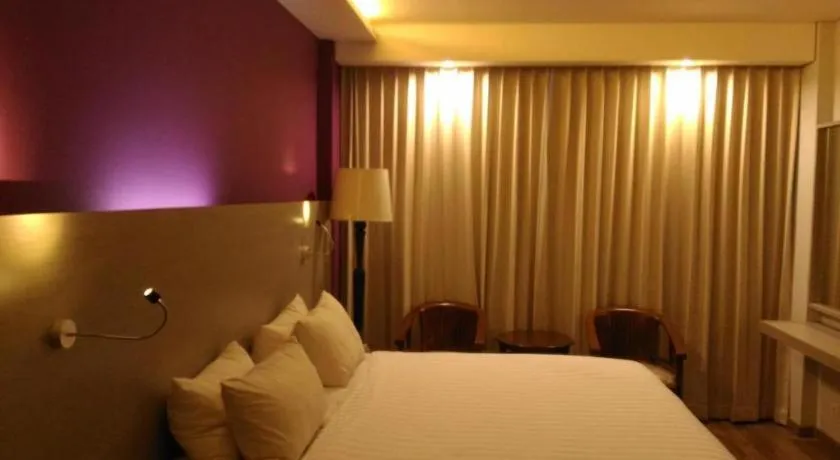 Bed in Kharisma Hotel