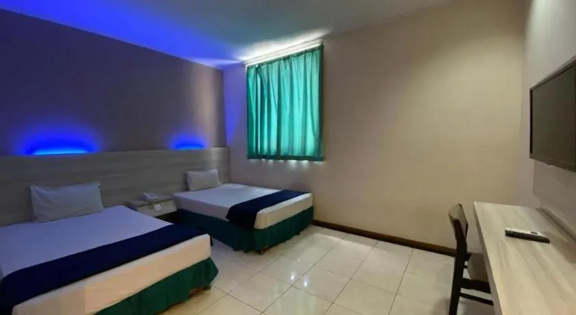 Bed in Kharisma Hotel