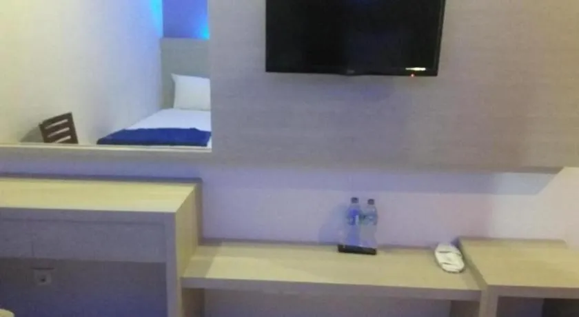 Bed in Kharisma Hotel