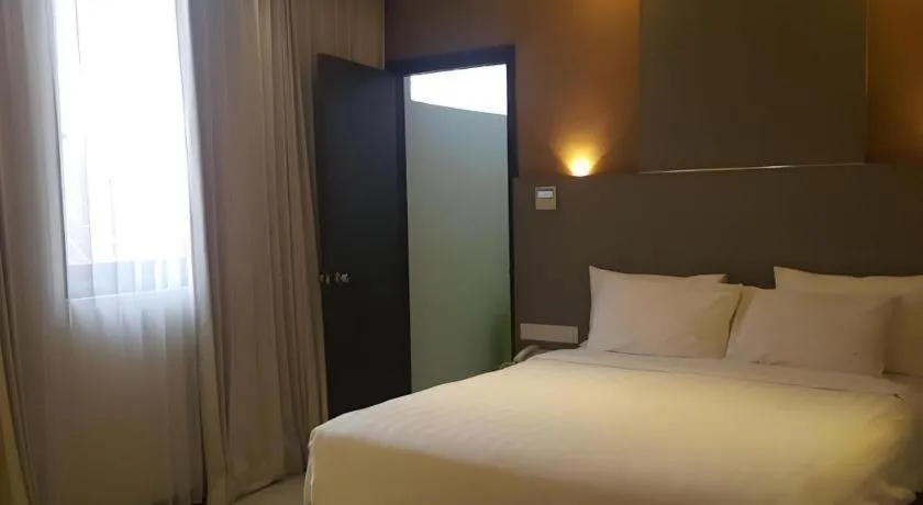 Bed in Kharisma Hotel