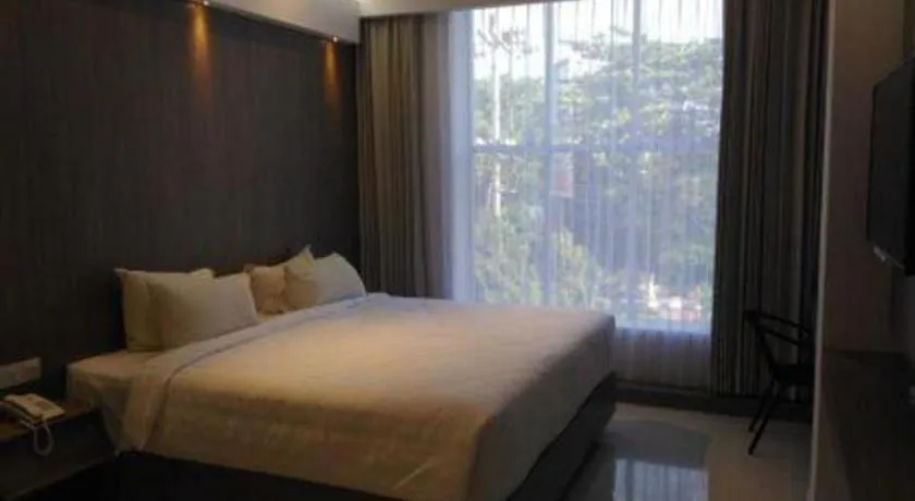 Bed in Kharisma Hotel