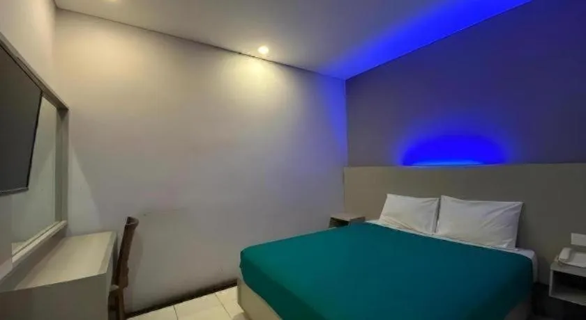 Bed in Kharisma Hotel