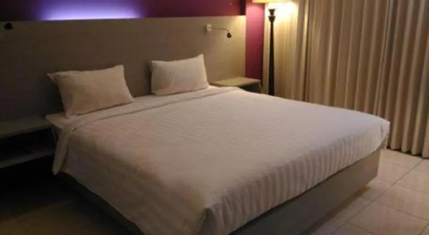Bed in Kharisma Hotel