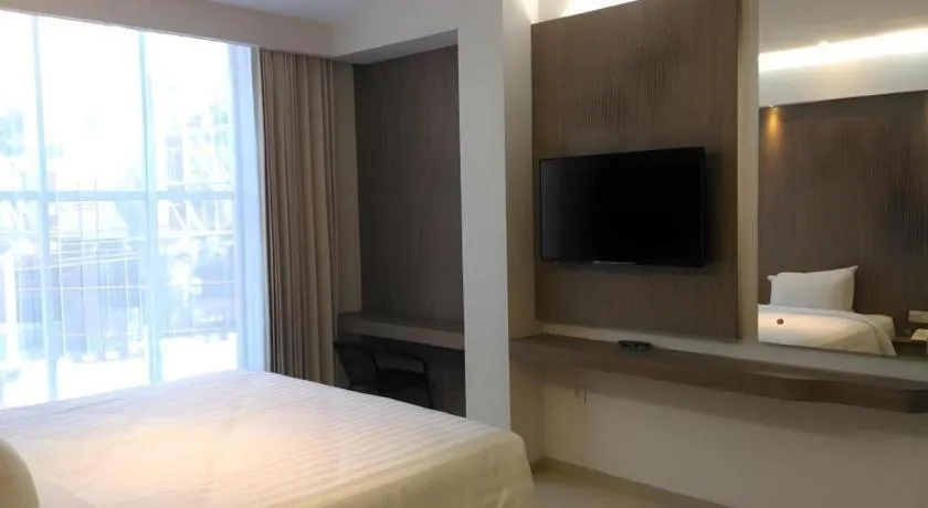 Bed in Kharisma Hotel