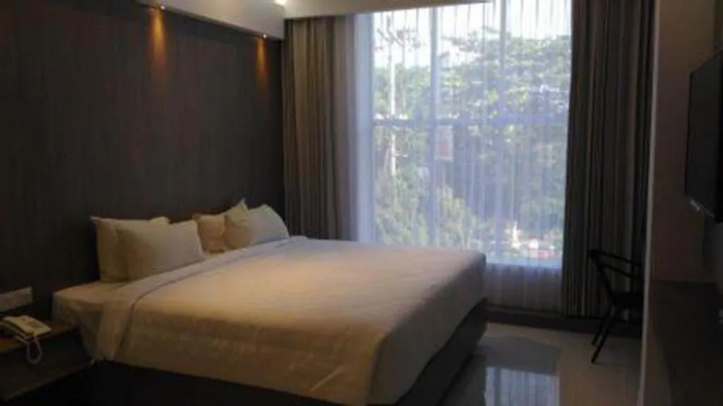 Bed in Kharisma Hotel
