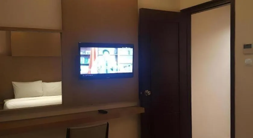 Bed in Kharisma Hotel