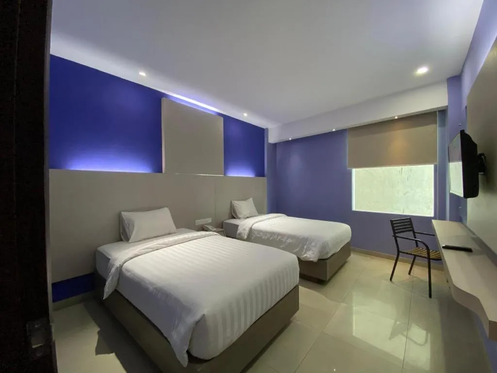 Bed in Kharisma Hotel