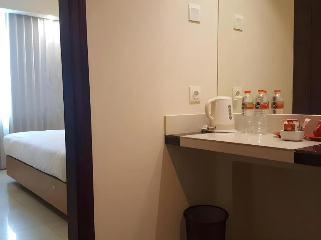 Bed in Kharisma Hotel