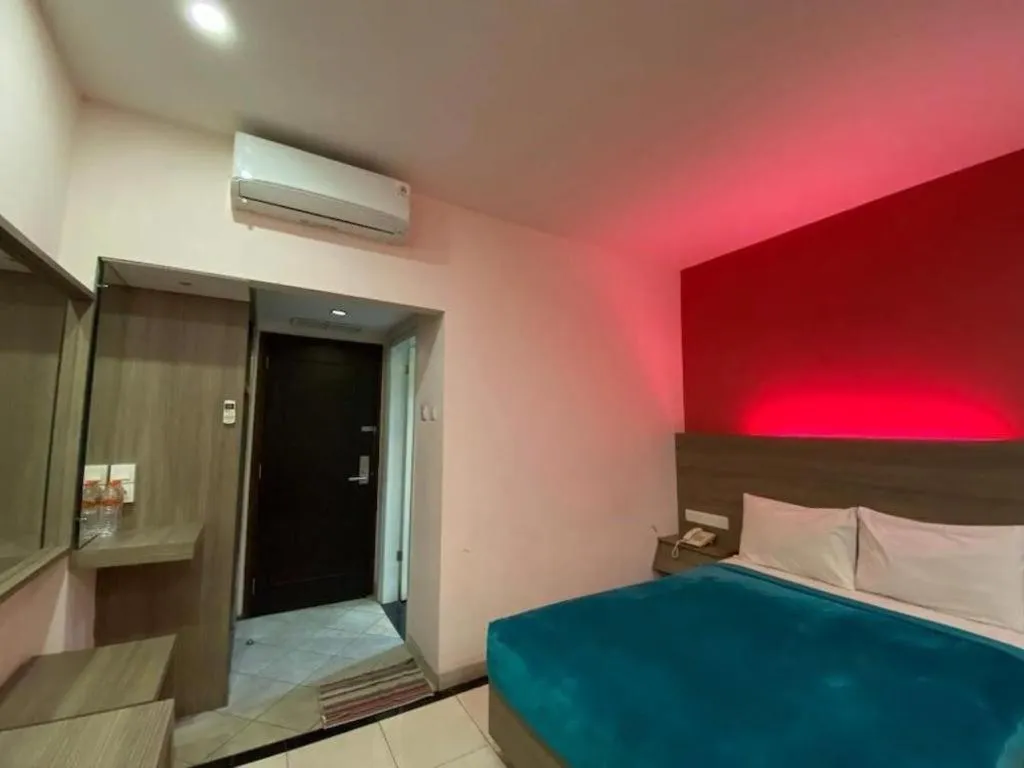 Bed in Kharisma Hotel