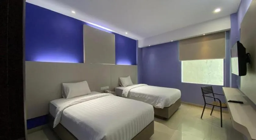 Bed in Kharisma Hotel