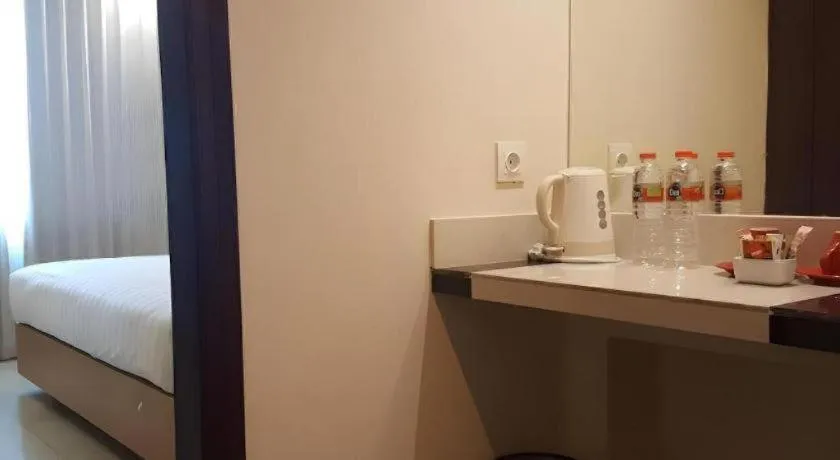 Bed in Kharisma Hotel