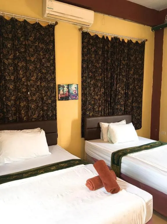 Bed in Sritrang Hotel