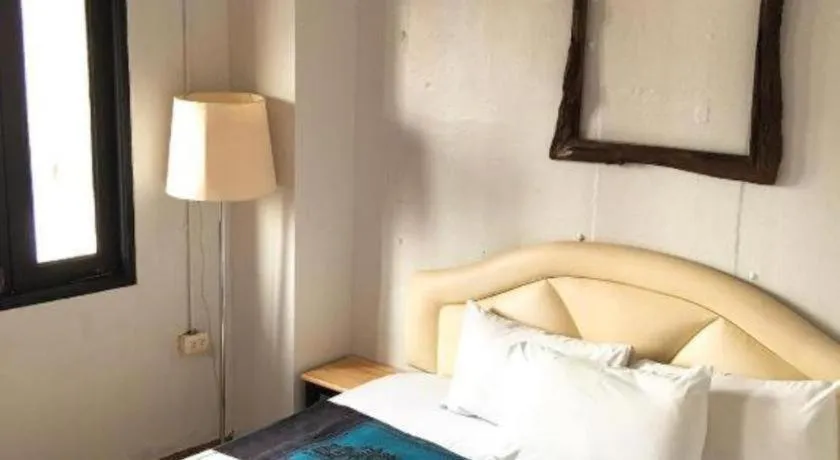 Bed in Sritrang Hotel