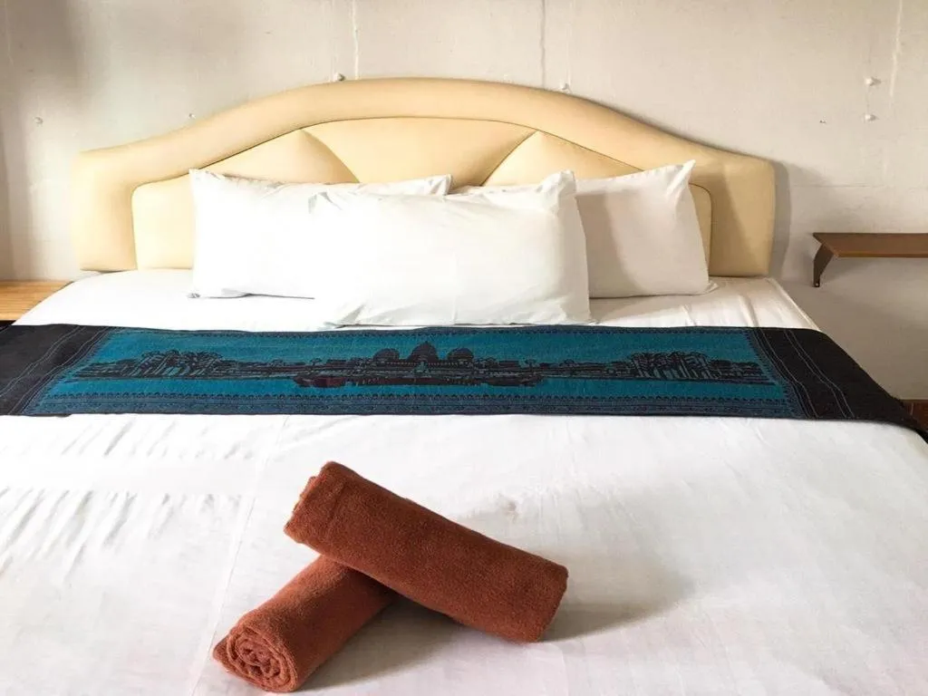 Bed in Sritrang Hotel