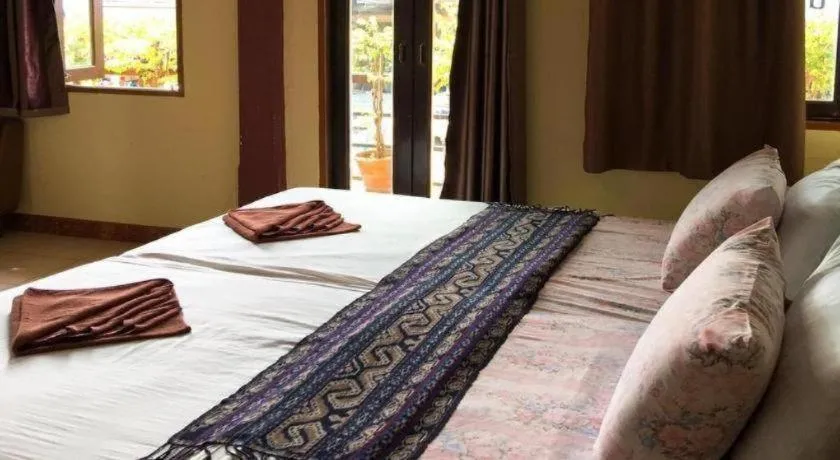 Bed in Sritrang Hotel