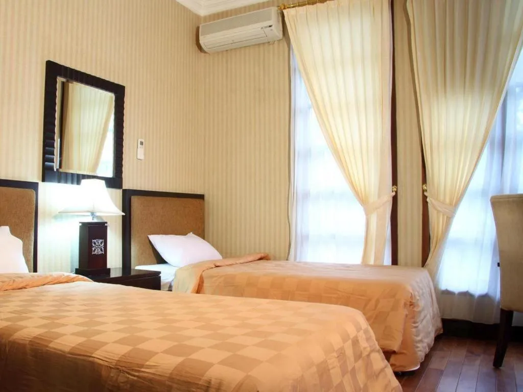 Bed in Campago Resort Hotel