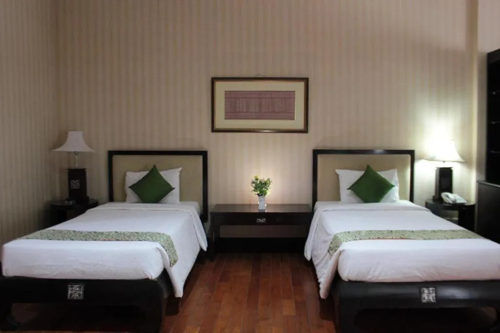 Bed in Campago Resort Hotel