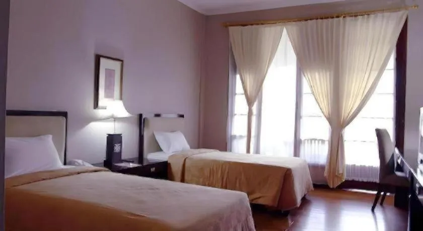 Bed in Campago Resort Hotel