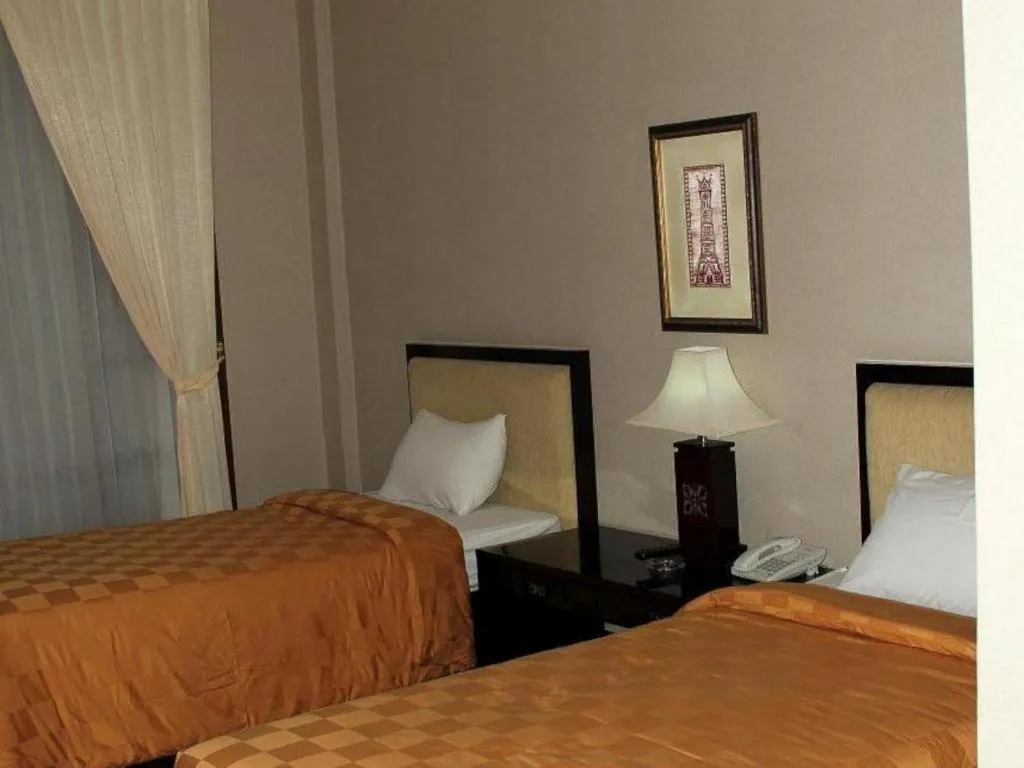 Bed in Campago Resort Hotel