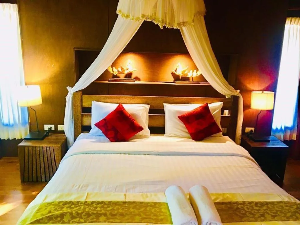 Bed in Chivaree Hotel and Resort