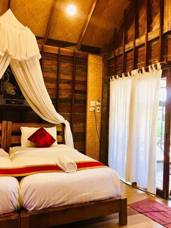 Bed in Chivaree Hotel and Resort