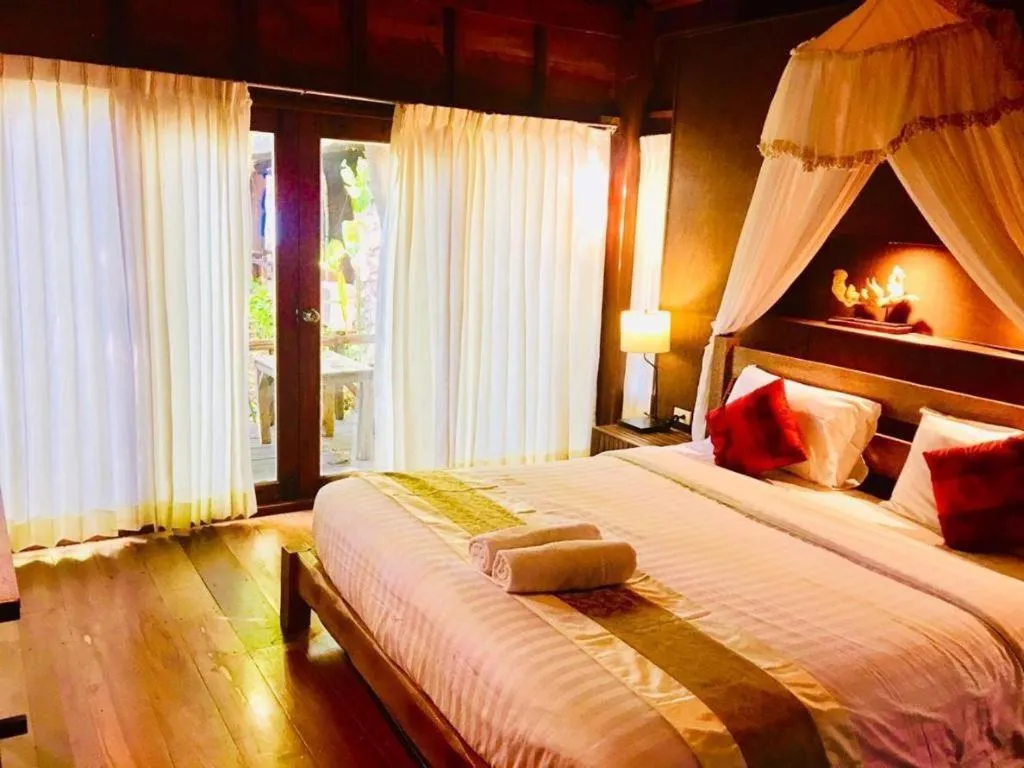 Bed in Chivaree Hotel and Resort