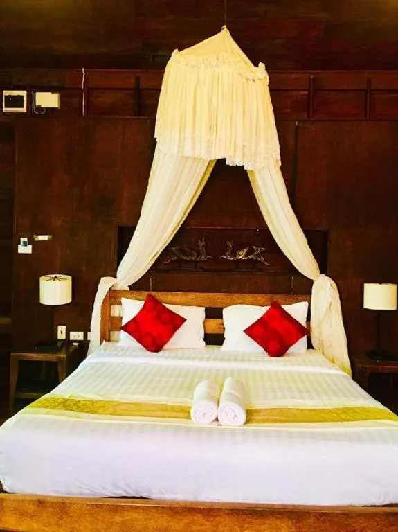 Bed in Chivaree Hotel and Resort