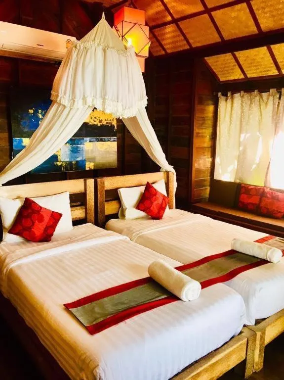 Bed in Chivaree Hotel and Resort