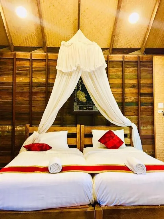 Bed in Chivaree Hotel and Resort