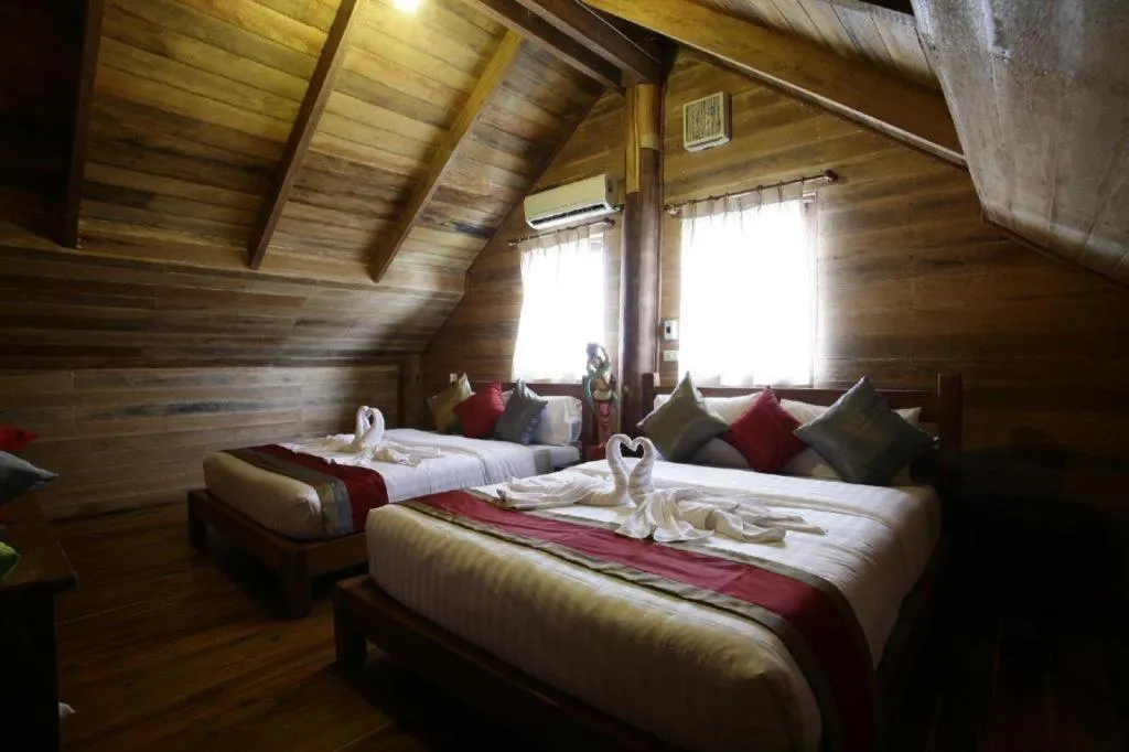 Bed in Chivaree Hotel and Resort