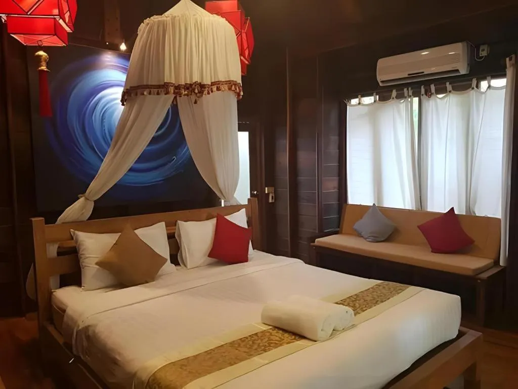 Bed in Chivaree Hotel and Resort