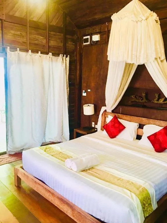 Bed in Chivaree Hotel and Resort