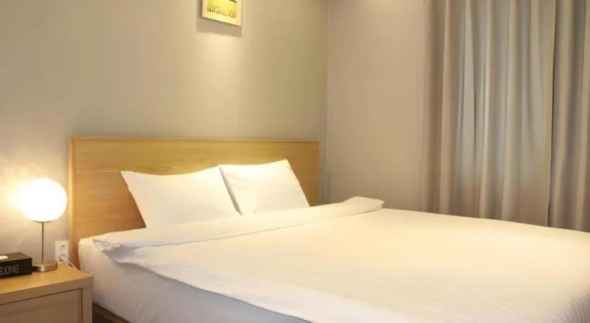Bed in Jeju Sejong Hotel