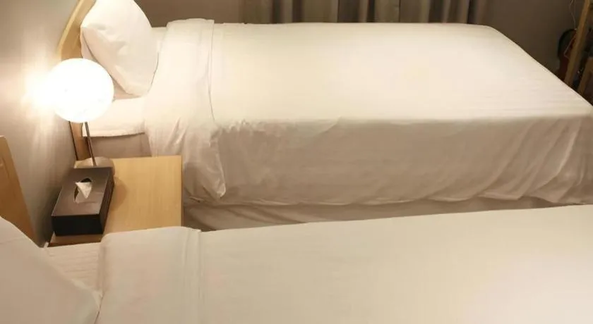 Bed in Jeju Sejong Hotel