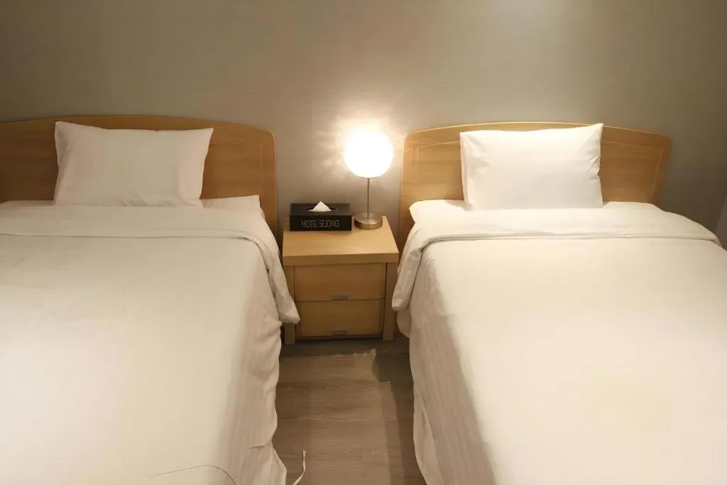 Bed in Jeju Sejong Hotel