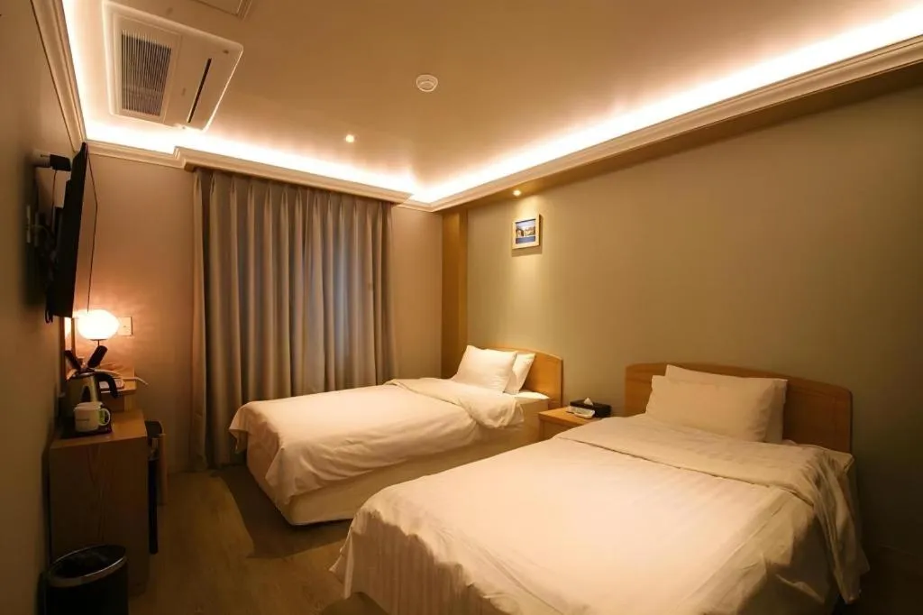 Bed in Jeju Sejong Hotel