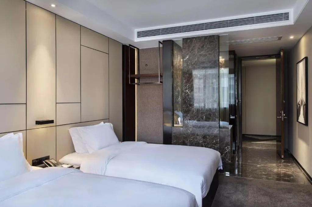 Bed in Zhonghao Boutique Hotel Dalang Business Center