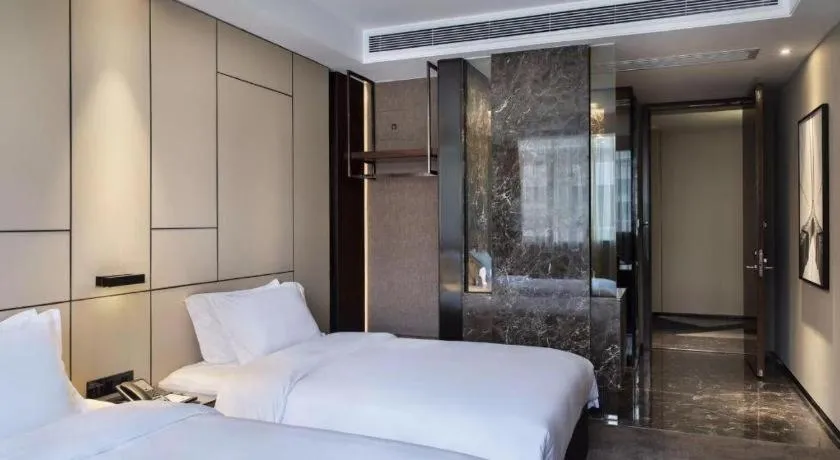 Bed in Zhonghao Boutique Hotel Dalang Business Center