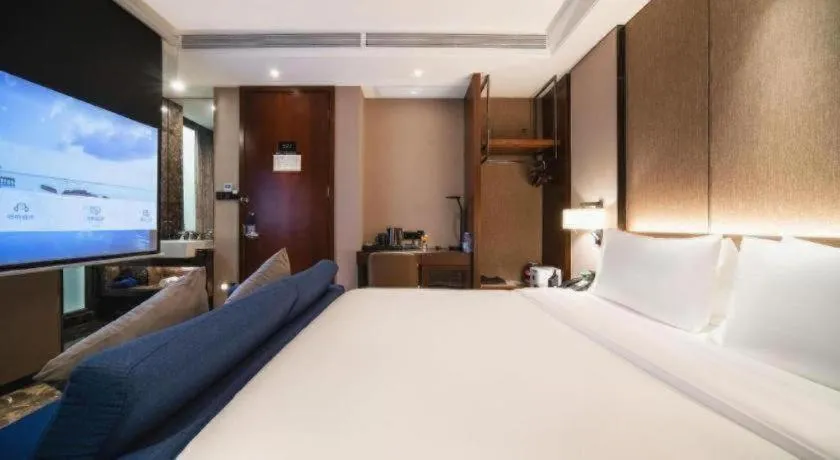 Bed in Zhonghao Boutique Hotel Dalang Business Center