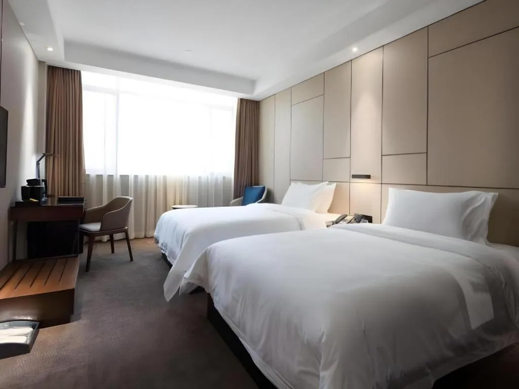 Bed in Zhonghao Boutique Hotel Dalang Business Center
