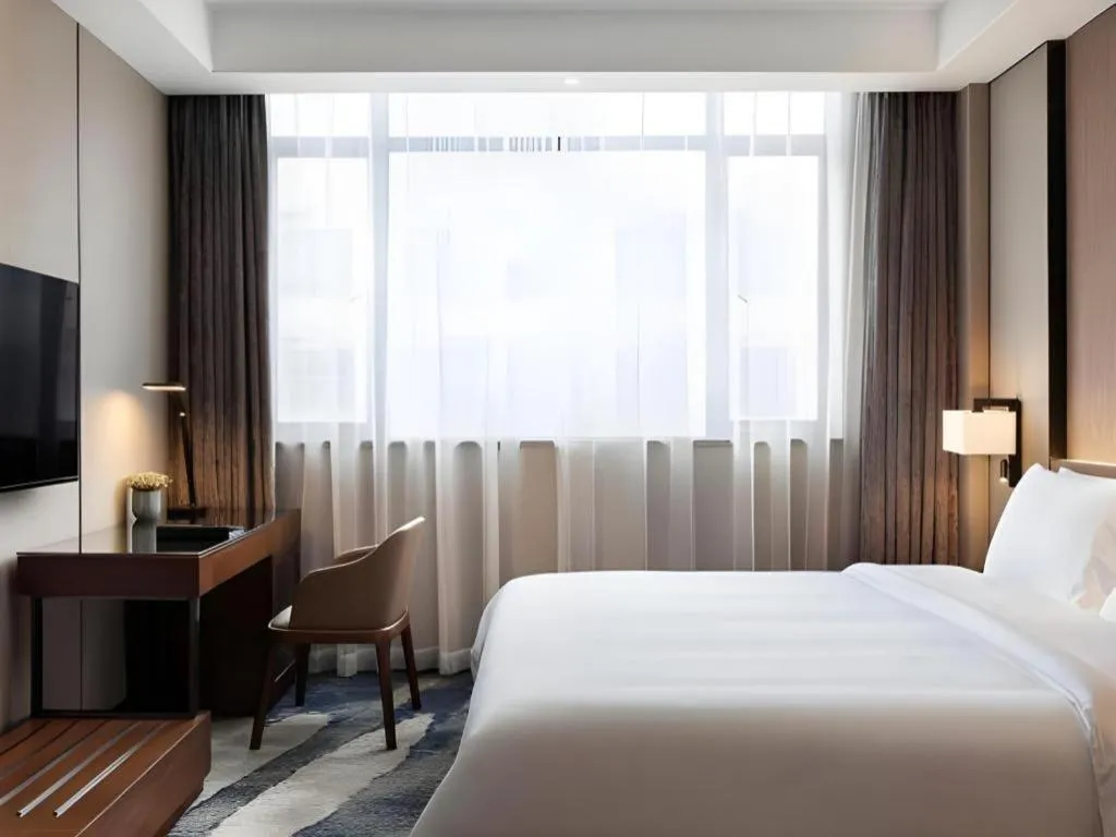 Bed in Zhonghao Boutique Hotel Dalang Business Center