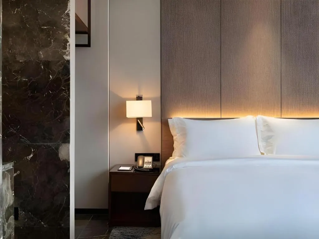 Bed in Zhonghao Boutique Hotel Dalang Business Center