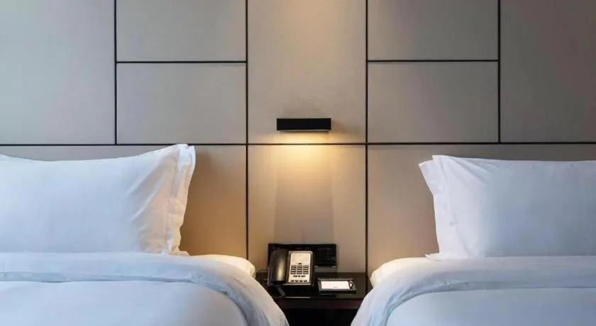 Bed in Zhonghao Boutique Hotel Dalang Business Center