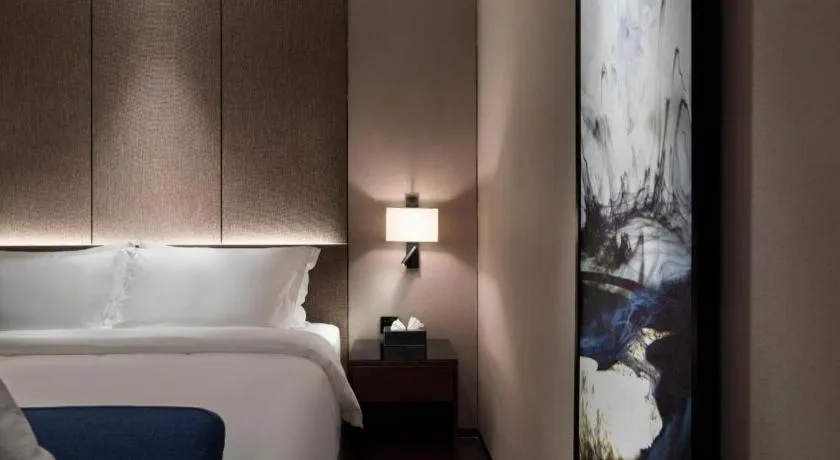 Bed in Zhonghao Boutique Hotel Dalang Business Center