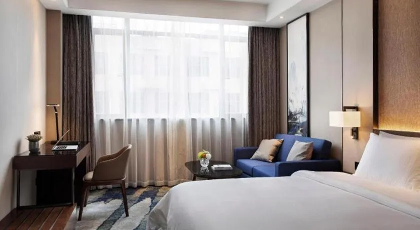 Bed in Zhonghao Boutique Hotel Dalang Business Center