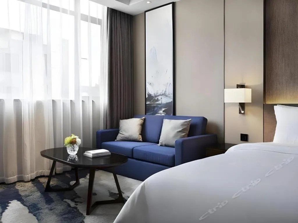 Bed in Zhonghao Boutique Hotel Dalang Business Center