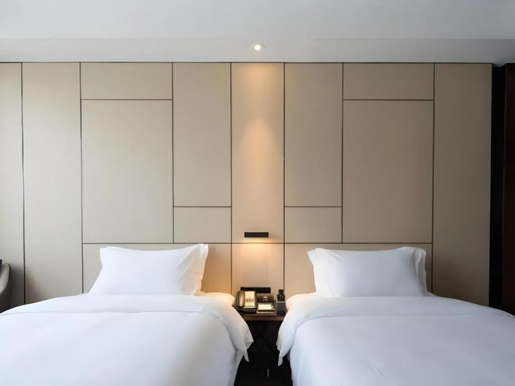 Bed in Zhonghao Boutique Hotel Dalang Business Center