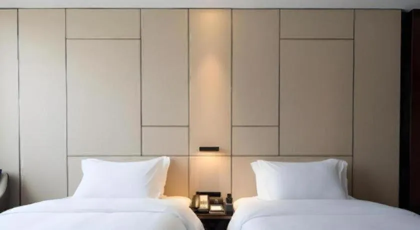Bed in Zhonghao Boutique Hotel Dalang Business Center