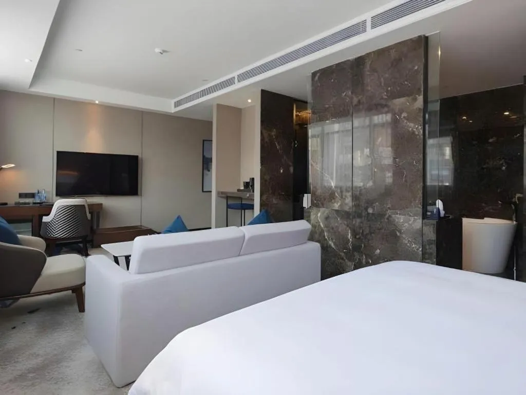 Bed in Zhonghao Boutique Hotel Dalang Business Center