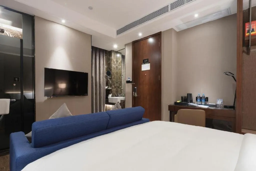 Bed in Zhonghao Boutique Hotel Dalang Business Center